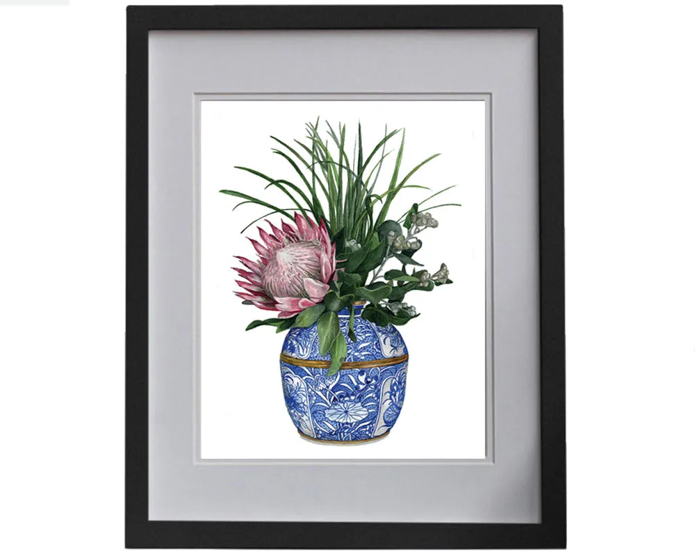 Print of a protea with wattle in a blue and white vase.